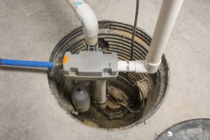 A sump pump installed in a basement of a home with a water powered backup system.