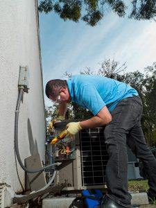 technician working on air conditioning unit