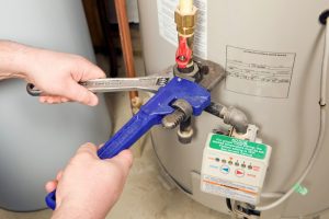 Water heater being worked on by a technician