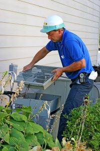 ac-tech-repairing-air-conditioner