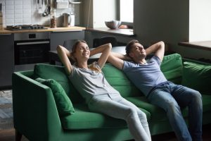 couple-relaxing-on-sofa