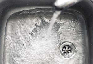 water-flowing-down-a-sink-drain