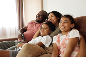 happy-family-sitting-on-couch