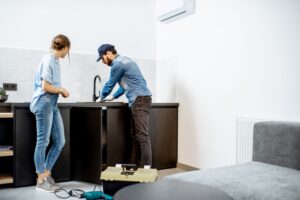 plumber-helping-homeowner-with-sink