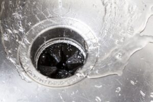 water-flowing-down-kitchen-sink-drain