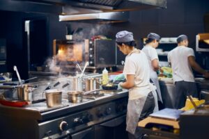 restaurant-kitchen-with-chefs-preparing-cooking-food